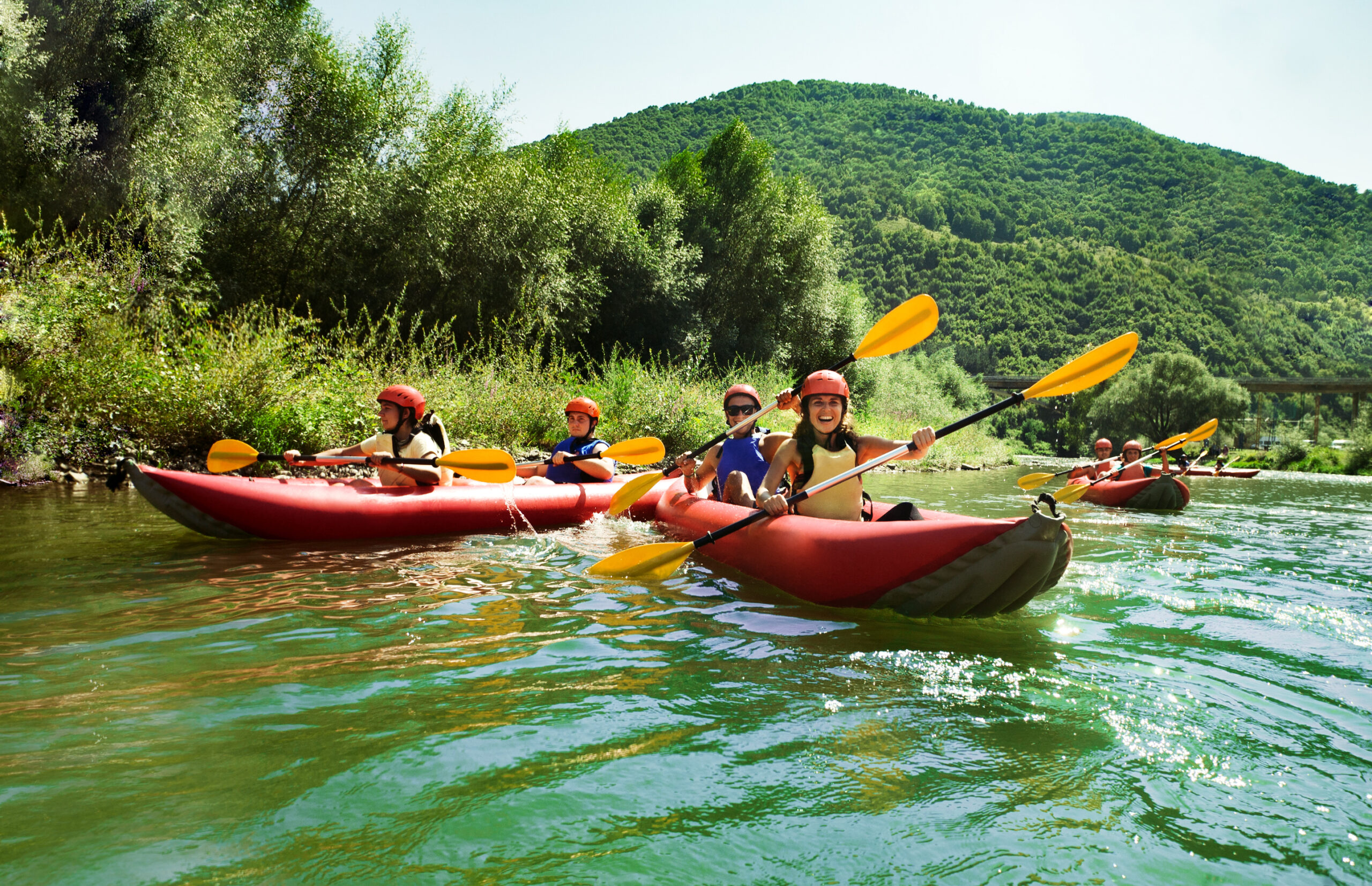 Several,Two,People,Team,Inflatable,Canoes,Rafting,In,A,Calm